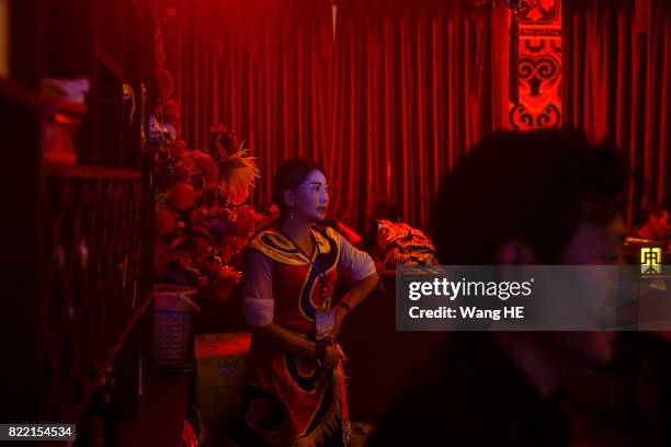 Tibetan bar girl waits for her guests in Tibetan Bar on July 22 ,2017 in Litang County, southwest of Garze Tibetan Autonomous Prefecture, Sichuan,...