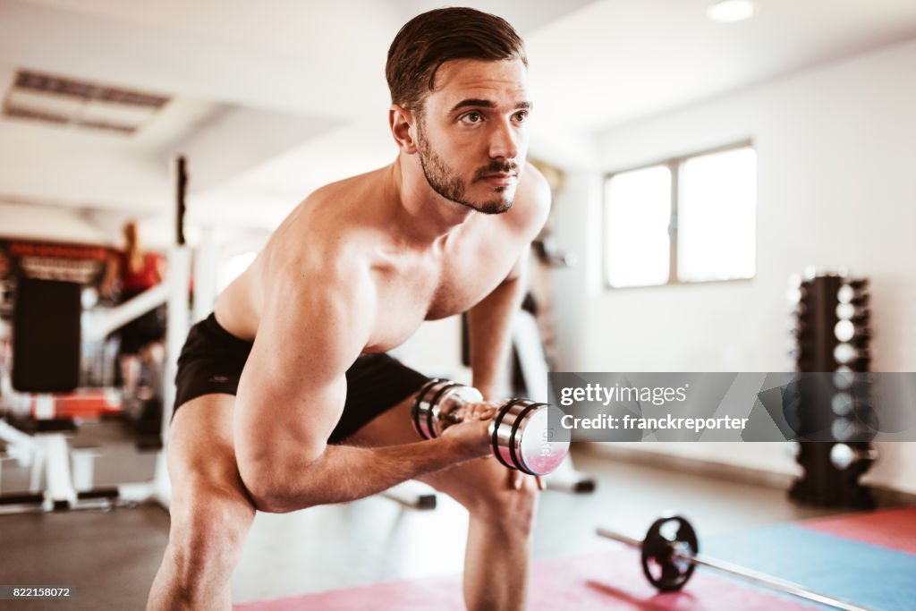 Fitness man showing the bicep