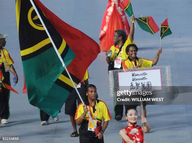 Athlete Priscila Tommy Vanuatu's flag bearer parades in front of her delegation during the 2008 Beijing Olympic Games opening ceremony on August 8,...