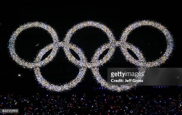 The Olympic rings are illuminated during the Opening Ceremony for the 2008 Beijing Summer Olympics at the National Stadium on August 8, 2008 in...