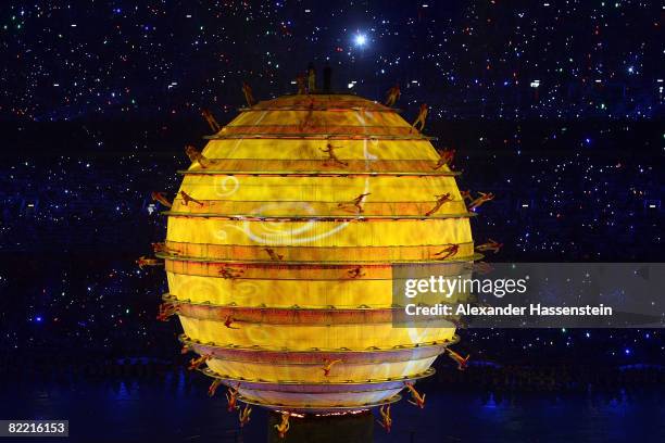 Artists perform around an illuminated Globe during the Opening Ceremony for the 2008 Beijing Summer Olympics at the National Stadium on August 8,...