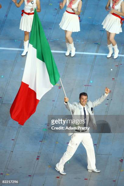Canoe/Kayaker Antonio Rossi of Italy carries his country's flag during during the Opening Ceremony for the 2008 Beijing Summer Olympics at the...