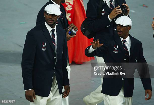 Basketball players LeBron James and Chris Paul of the United States walk with their delegation during the Opening Ceremony for the 2008 Beijing...