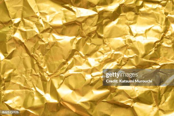 gold paper texture background - wrapping paper stock-fotos und bilder