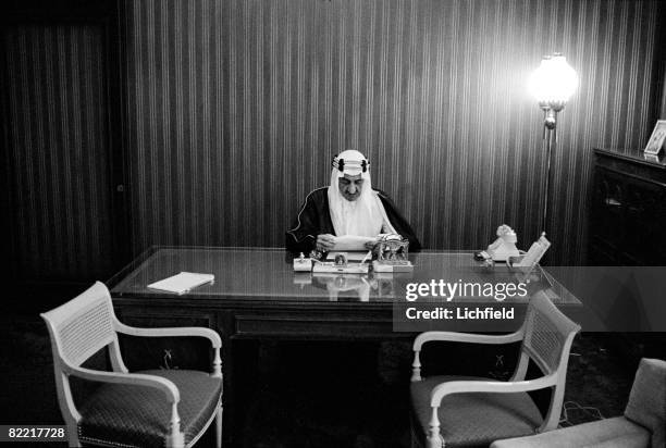 King Faisal of Saudi Arabia photographed in his office in Riyadh, Saudi Arabia on 25th April 1967. .