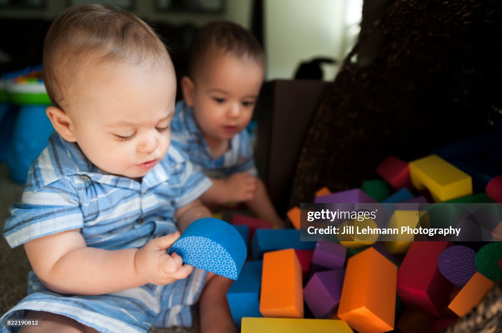 12 Month Old Twin Babies Spill and Play with Toy Blocks Together