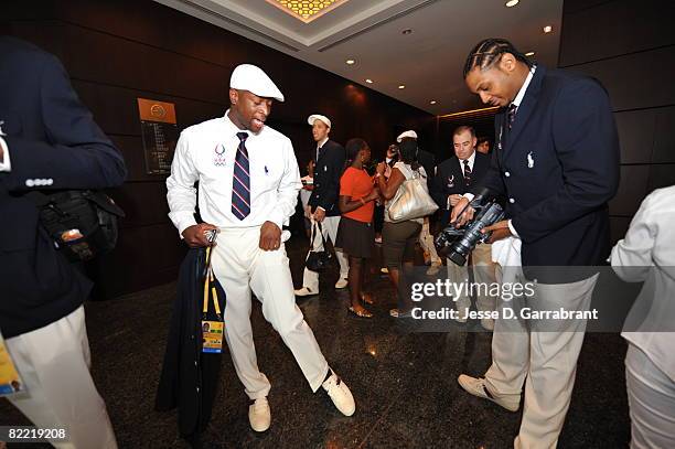 Carmelo Anthony videotapes Dwyane Wade of the U.S. Men's Senior National Basketball Team before leaving the hotel on their way to the Opening...