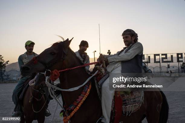 Men ride horses in a parking lot on Nader Khan Hill on July 21, 2017 in Kabul, Afghanistan. Despite a heavy security presence throughout the city,...