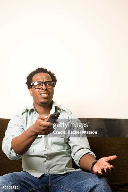 Man Using Remote Control 618 Black Man Remote Control Stock Photos, High-Res Pictures, and ...