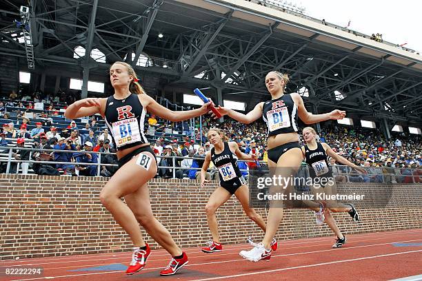 College Track & Field: Penn Relays, Rutgers Erin Berg in action, passing baton to teammate Alexis Gray during anchor leg of 4x800M Relay at Franklin...