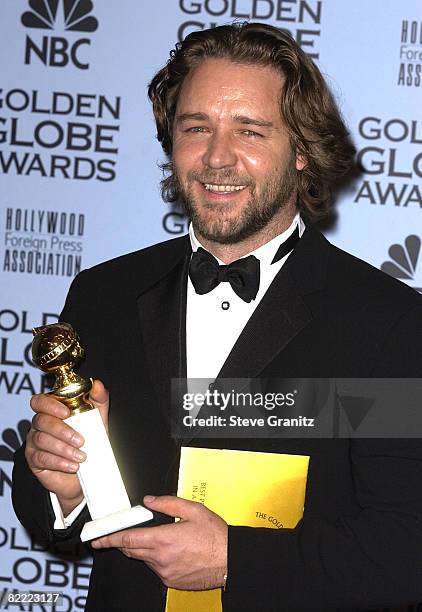 Russell Crowe holds his award for Best Actor in a Motion Picture, Drama for his role in "A Beautiful Mind" at the 59th Annual Golden Globe Awards...