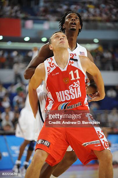 Zakhar Pashutin of the Russia National Team boxes out Chris Bosh of the U.S. Men's Senior National Team during a a Pre-Olympic Friendly at the...