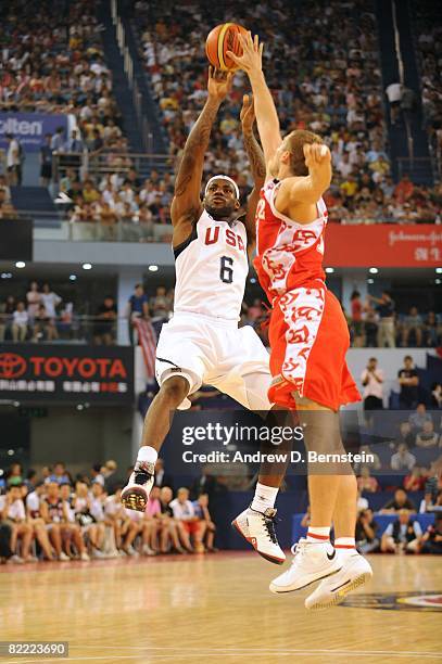 LeBron James of the U.S. Men's Senior National Team goes up for a shot during a Pre-Olympic Friendly against the Russia National Team at the Qizhong...