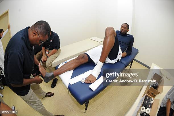 Kobe Bryant of the U.S. Men's Senior National Team gets his ankles taped prior to a Pre-Olympic Friendly against the Russia National Team at the...