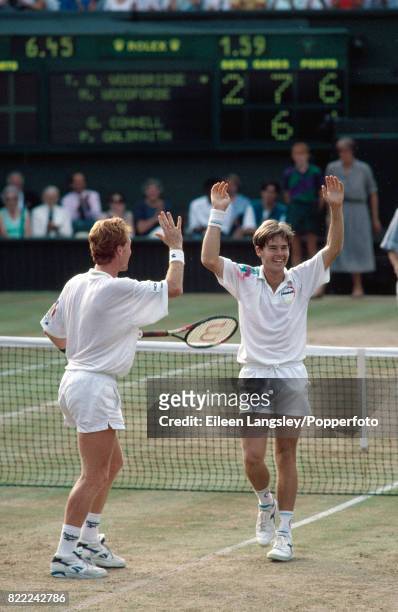 Mark Woodforde and Todd Woodbridge of Australia celebrate winning the men's doubles final in straight sets during the Wimbledon Lawn Tennis...