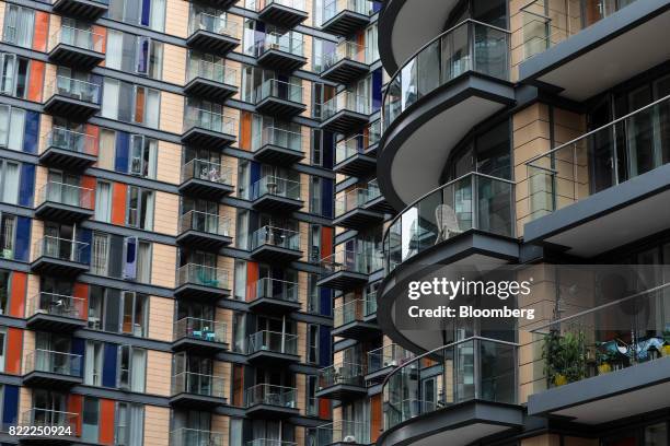 Balconies sit on the outside of residential flats near the Canary Wharf financial, business and shopping district in London, U.K., on Tuesday, July...