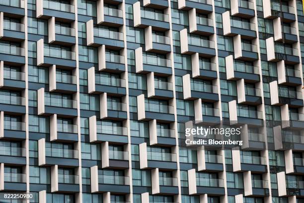 Balconies sit on the outside of residential flats on the Greenwich Peninsula construction site in London, U.K., on Tuesday, July 25, 2017. U.K. House...