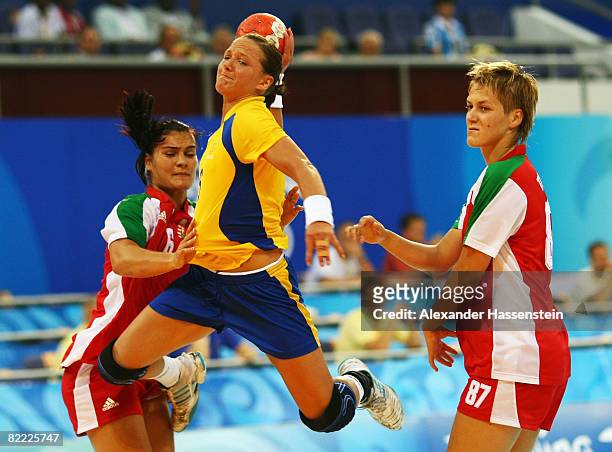 Therese Islas Helgesson of Sweden shoots at goal during the handball match between Hungary and Sweden held at the Olympic Sports Center Gymnasium...