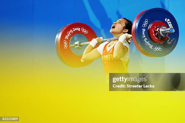 Chen Xiexia of China competes in the Women's 48kg Group A Weightlifting event held at the Beijing University of Aeronautics and Astronautics...