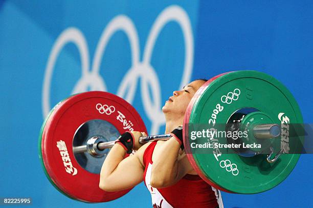 Hiromi Miyake of Japan competes in the Women's 48kg Group A Weightlifting event held at the Beijing University of Aeronautics and Astronautics...