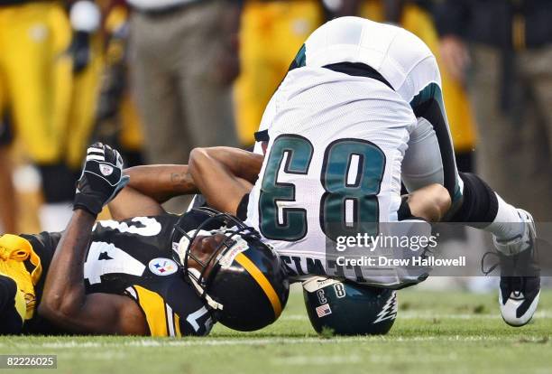 Wide Receiver Greg Lewis of the Philadelphia Eagles lands on his head after getting hit by cornerback Ike Taylor of the Pittsburgh Steelers on August...