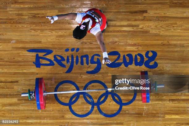 Chen Xiexia of China celebrates her final lift in the Women's 48kg Group A Weightlifting event held at the Beijing University of Aeronautics and...