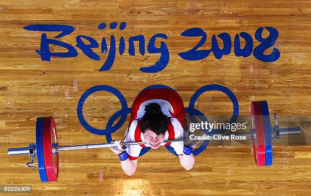 Hiromi Miyake of Japan competes in the Women's 48kg Group A Weightlifting event held at the Beijing University of Aeronautics and Astronautics...