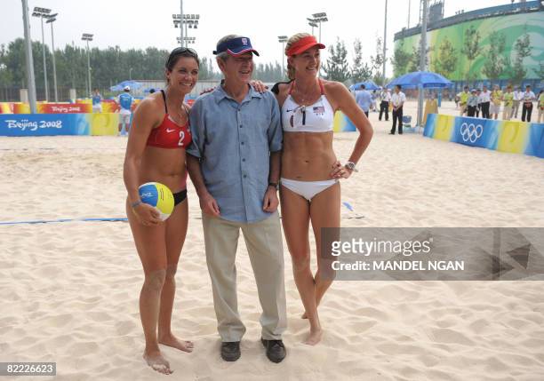 Women's beach volleyball player's Misty May Treanor and Kerri Walsh pose for pictures with US President George W. Bush during a visit to the beach...