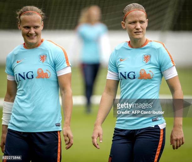 Netherlands' midfielder Sheila van den Bulk and defender Mandy van den Berg attend a training session in Zeist, The Netherlands, on July 25 a day...
