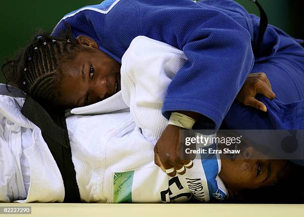 Yanet Bermoy of Cuba competes against Glenda Miranda of Ecuador in their 48 kg preliminary judo bout held at the Beijing Science and Technology...
