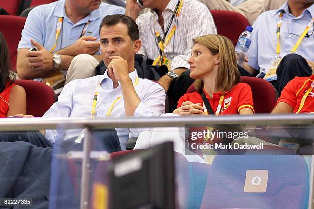 Prince Felipe and Princess Letizia of Spain watch the game between China and Spain during the women's preliminary basketball game at the Beijing...