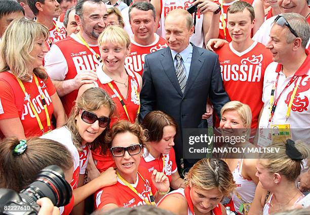 Russian Premier Vladimir Putin meets with members of the Russian National team during his visit at the Olympic village in Beijing, China, on August...