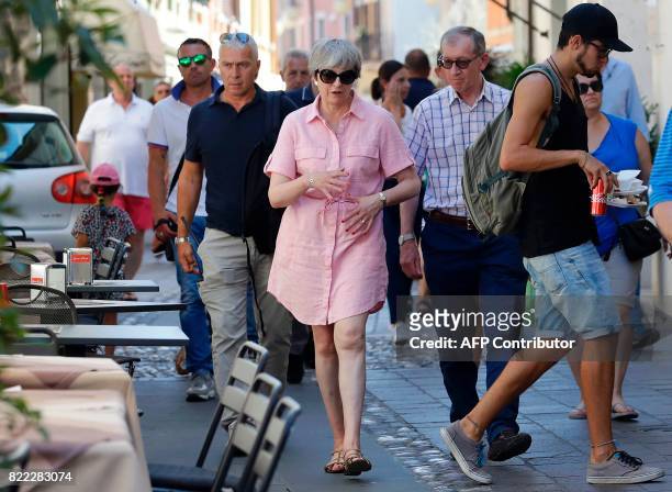 Britain Prime Minister Theresa May walks with her husband Philip in Desenzano del Garda, by the Garda lake, as they holiday in northern Italy, on...