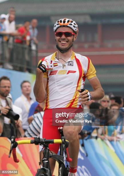 Samuel Sanchez of Spain celebrates winning the gold medal in the Men's Road Cycling event held on the Road Cycling Course during day 1 of the Beijing...