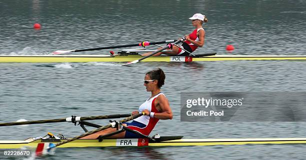 Sophie Balmary of France and Julia Michalska of Poland compete at the start of the women's single sculls held at Shunyi Olympic Rowing-Canoeing Park...