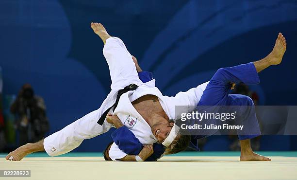 Gal Yekutiel of Israel takes on Craig Fallon of Great Britain during the men's -60kg repechage judo held at the Beijing Science and Technology...