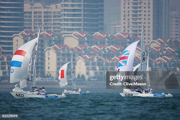 Mandy Mulder, Annemieke Bes and Merel Witteveen of the Netherlands lead from Sarah Ayton, Sarah Webb and Pippa Wilson of Great Britain as they...