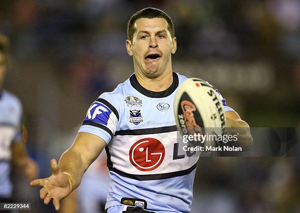 Greg Bird of the Sharks passes during the round 22 NRL match between the Cronulla-Sutherland Sharks and the South Sydney Rabbitohs held at Toyota...