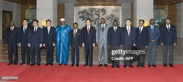 Chinese President Hu Jintao poses with presidents of eight African countries at the Diaoyutai State Guesthouse compound on August 9, 2008.More than...