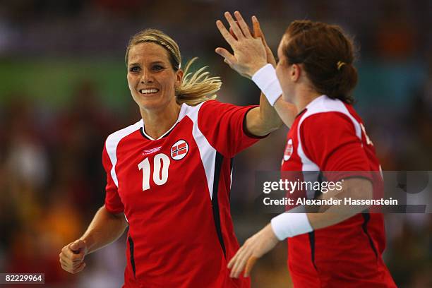 Gro Hammerseng of Norway celebrates after scoring a goal with team mate Karoline Dyhre Breivang during the handball match between Norway and China...