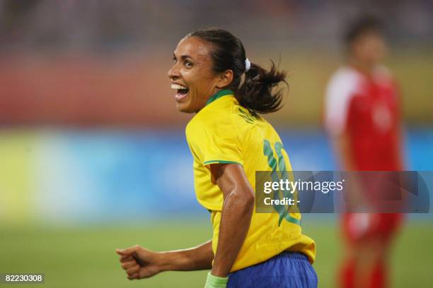 Marta of Brazil celebrates after her teammate Daniela scored against North Korea during the 2008 Beijing Olympic Games first round Group F women's...