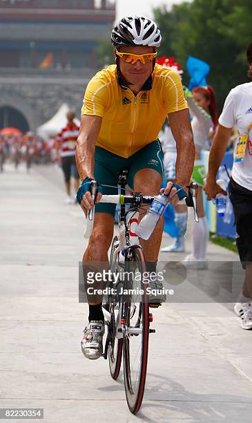 Stuart O'Grady of Australia rides to the start line before the Men's Road Cycling event held on the Road Cycling Course during day 1 of the Beijing...