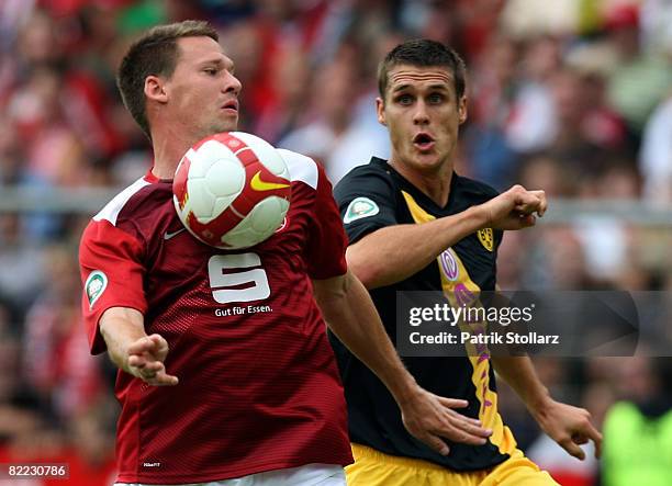 Sebastian Kehl of Dortmund battles for the ball with Michael Lorenz of Essen during the DFB Cup first leg match between Rot-Weiss Essen and Borussia...