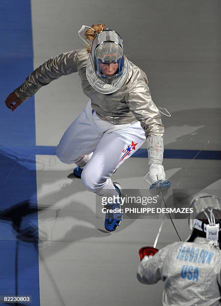Mariel Zagunis competes against compatriot Sada Jacobson during the women's individual sabre final match on August 9, 2008 at the Fencing Hall of...