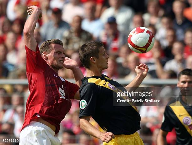 Sebastian Kehl of Dortmund battles for the ball with Michael Lorenz of Essen during the DFB Cup first leg match between Rot-Weiss Essen and Borussia...