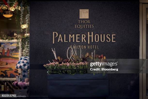 Signage is displayed on the exterior of the Palmer House Hilton hotel in downtown Chicago, Illinois, U.S., on Monday, July 24, 2017. Hilton Worldwide...