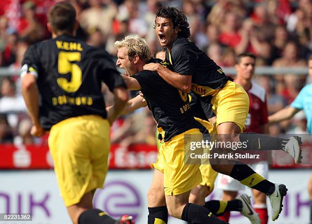 Florian Kringe , Nelson Valdez and Sebastian Kehl of Dortmund celebrate after the 1-2 during the DFB Cup first leg match between Rot-Weiss Essen and...