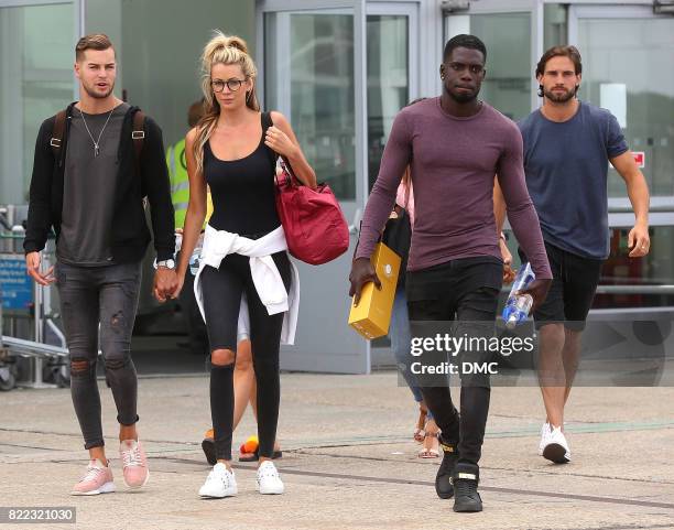 Chris Hughes, Olivia Attwood, Marcel Somerville and Jamie Jewitt from Love Island arrive at Stanstead airport on July 25, 2017 in London, England.