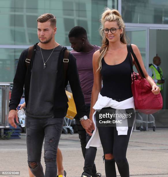 Chris Hughes and Olivia Attwood from Love Island arrive at Stanstead airport on July 25, 2017 in London, England.