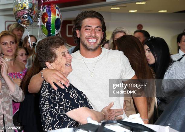 Love Island winner Kem Cetinay is greeted by his grandma as he arrives at Stanstead airport and meets his gran on July 25, 2017 in London, England.